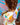 Traje de baÃ±o de niÃ±a manga larga con diseÃ±os coloridos, ideal para protecciÃ³n solar en la playa o piscina.