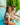 NiÃ±a sentada al borde de la piscina, luciendo un vestido de baÃ±o dos piezas OrquÃ­deas Anggie Crudo con mangas abullonadas.